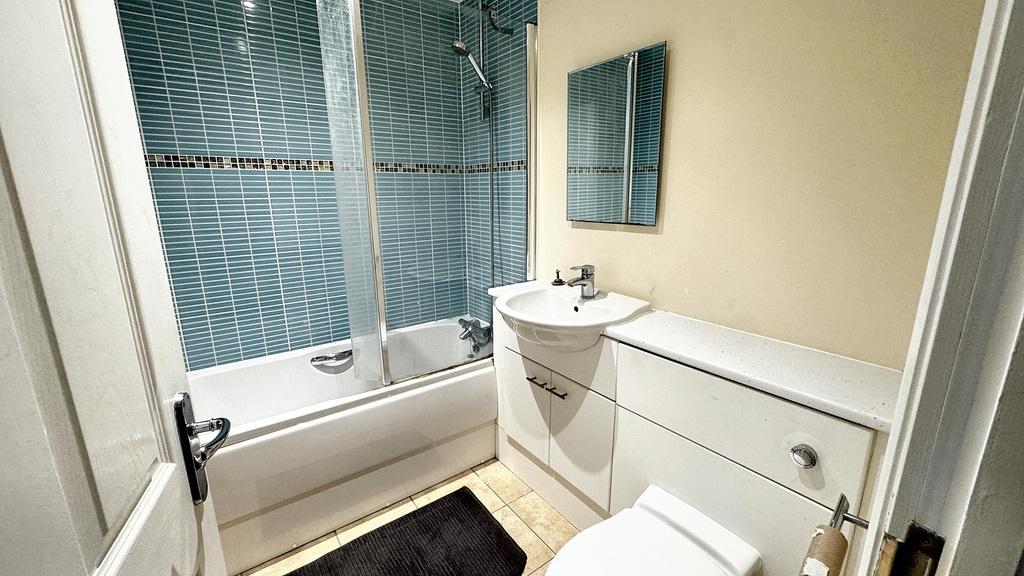 A clean and well-maintained bathroom featuring ...