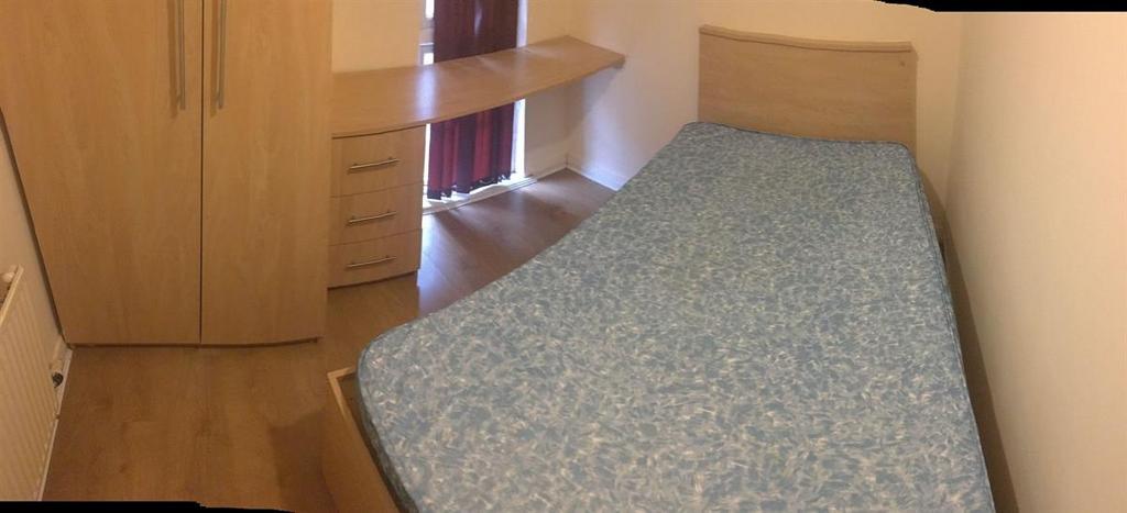 Neat single bedroom with a bed, fitted wardrobe...