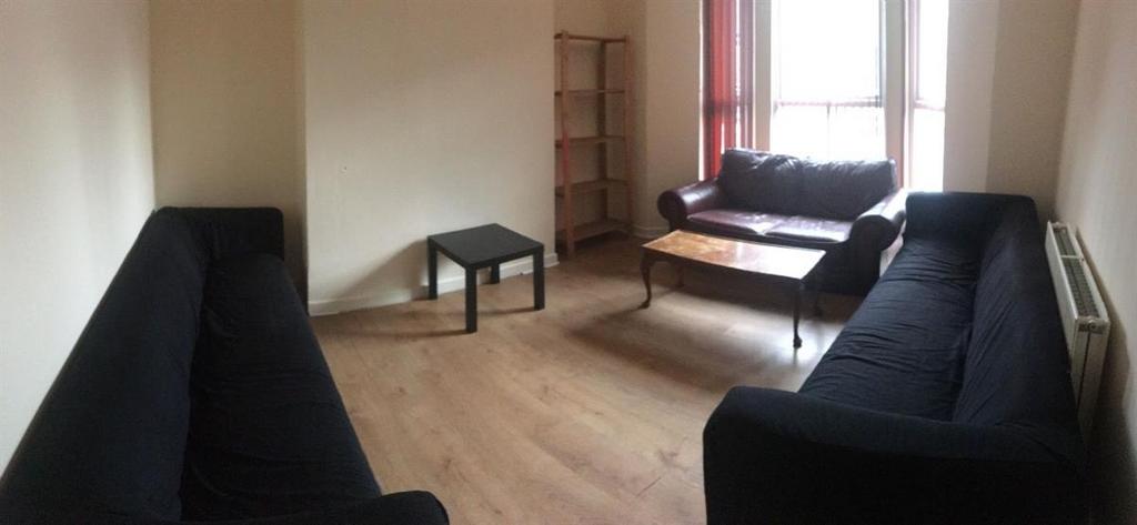 Bright, simply styled living room with matching...
