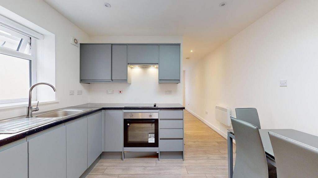 Bright modern kitchen with sleek grey cabinetry...