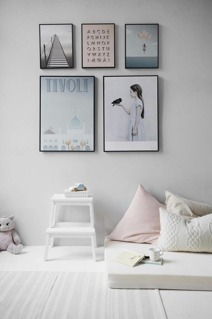 A bright and minimalist living room featuring s...