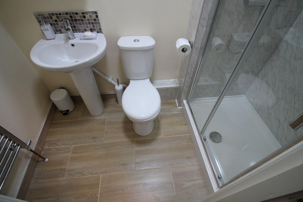 Bright, modern bathroom with a walk-in shower, ...