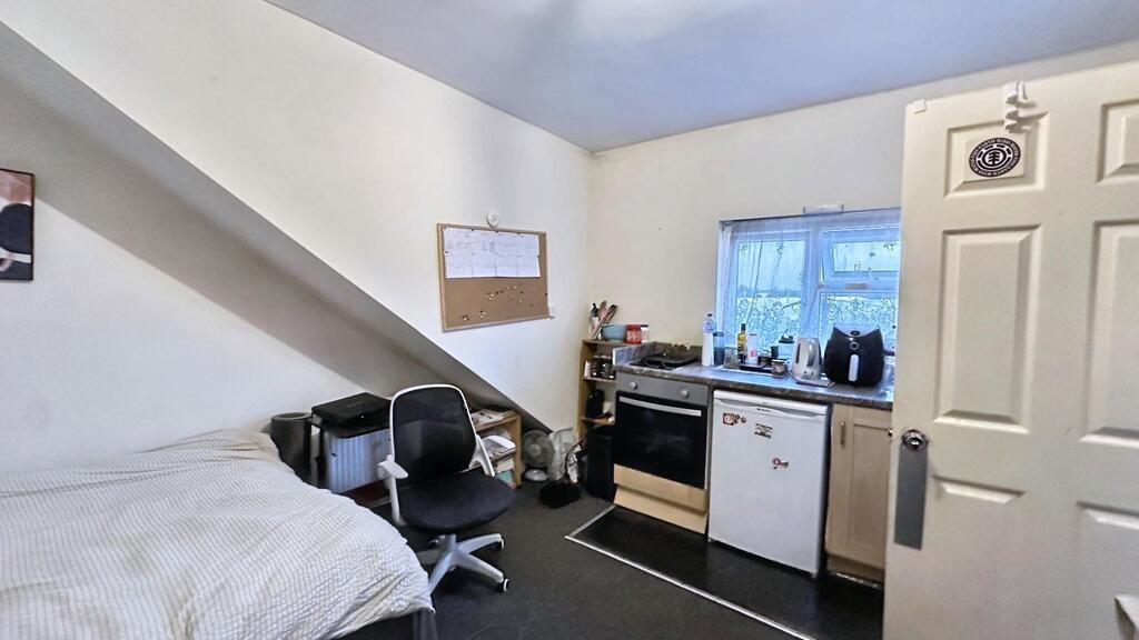 Well-presented bedroom with a comfortable bed, ...