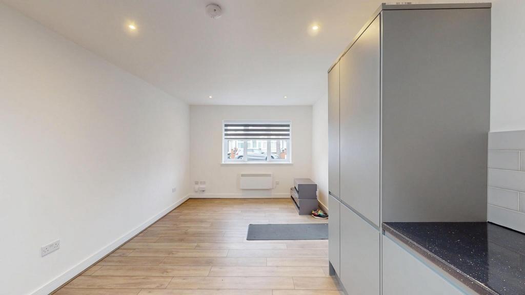 Bright, modern living area with neutral décor, ...