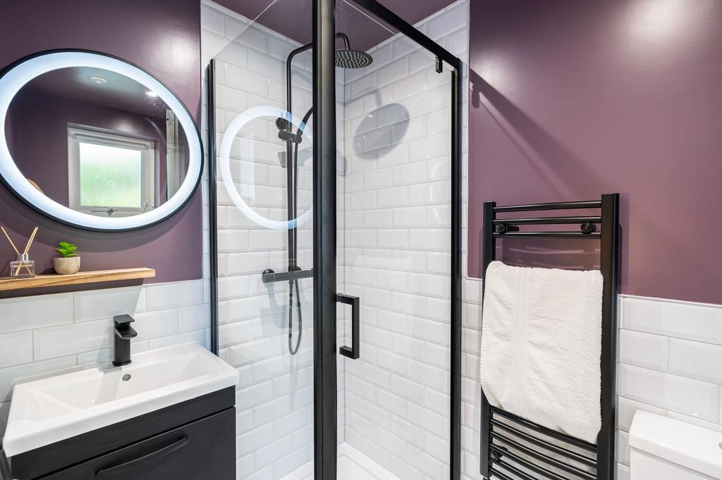 Modern and stylish bathroom featuring a sleek w...