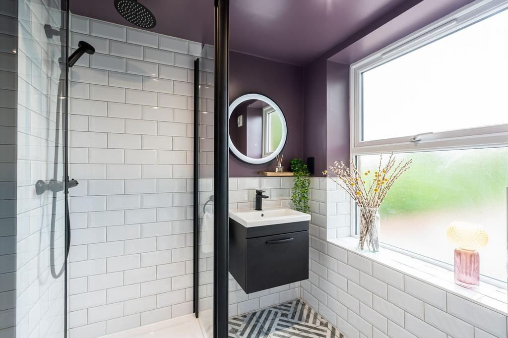 Modern bathroom with a spacious shower area, sl...