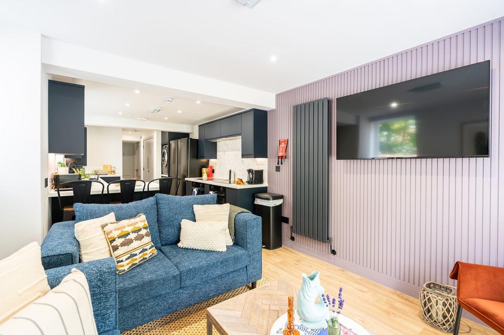 Bright and stylish living room featuring a larg...