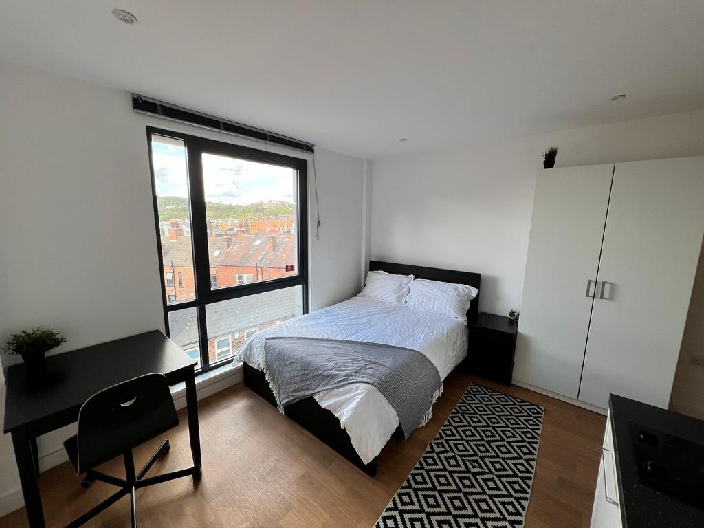 Bright, modern double bedroom with large floor-...