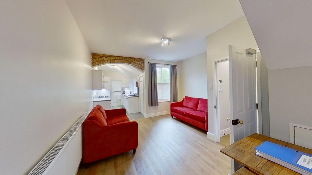 Bright furnished living room with two vibrant r...