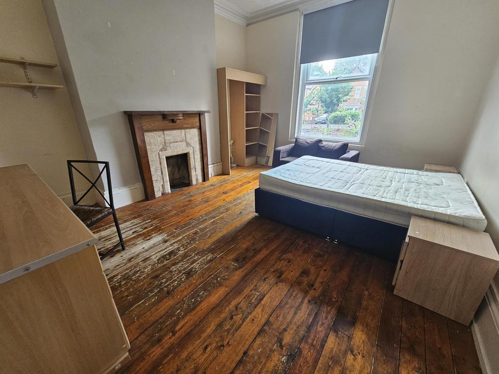 Bright period bedroom with original wooden floo...