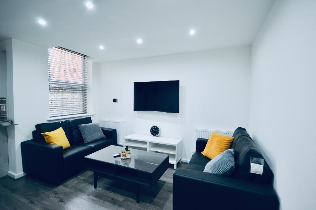 Modern and stylish living room featuring comfor...