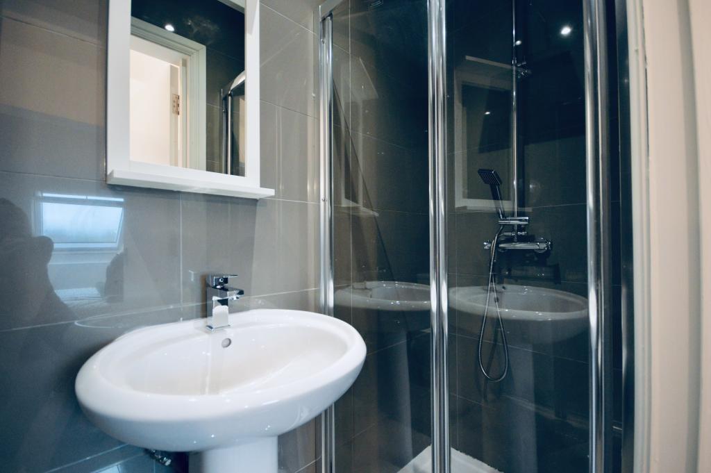 A clean and modern bathroom featuring a spaciou...