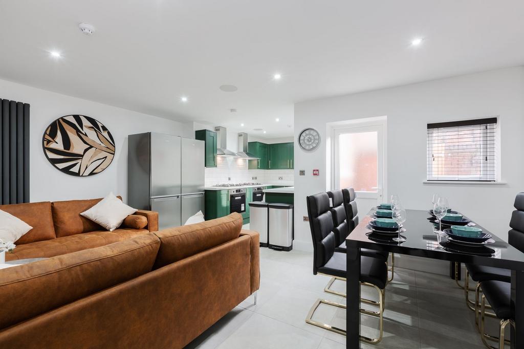 A spacious and modern living room with a comfor...