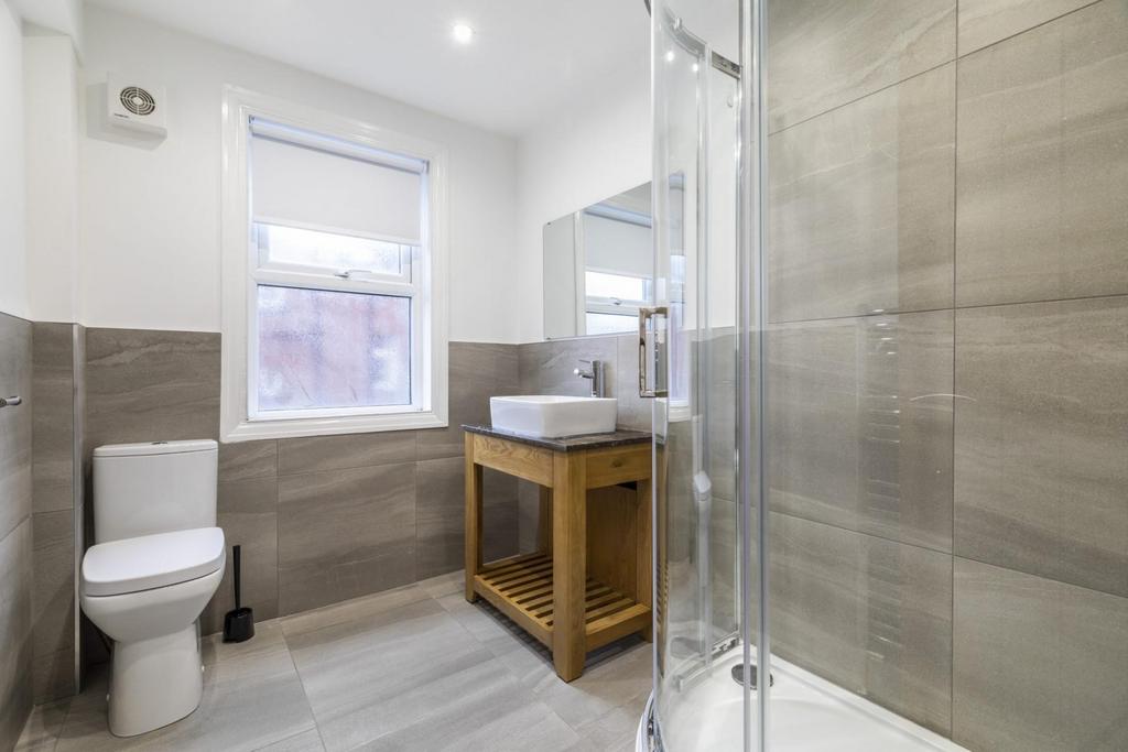 Modern, well-maintained bathroom with a walk-in...