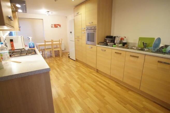 A well-maintained kitchen with ample counter sp...
