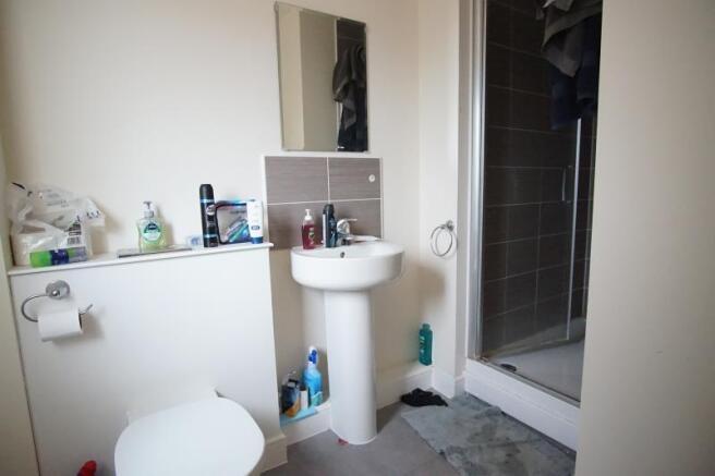 A clean and functional bathroom featuring a sin...