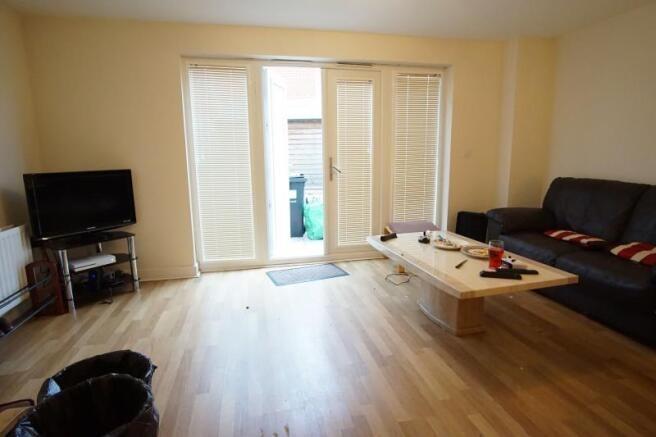 Bright, modern living room with light wood floo...