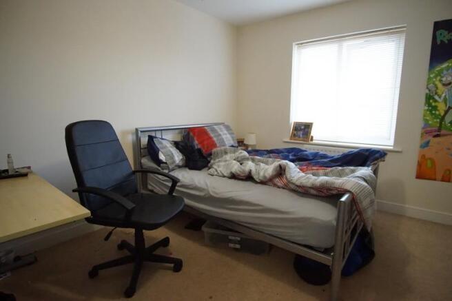 Simple, functional single bedroom with a large ...
