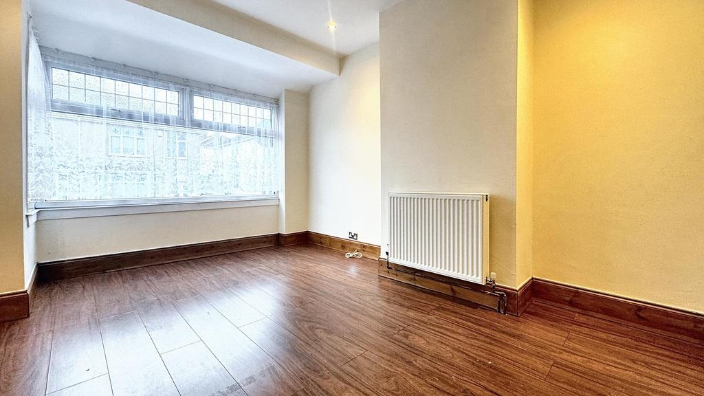 Bright bedroom with large front-facing window, ...