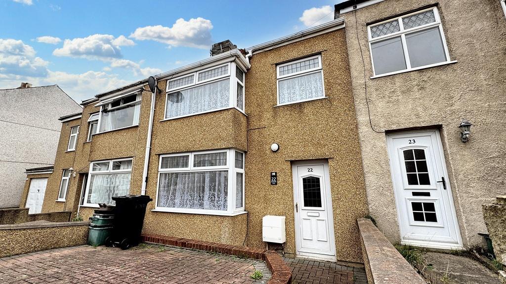 Terraced property with a paved front driveway, ...