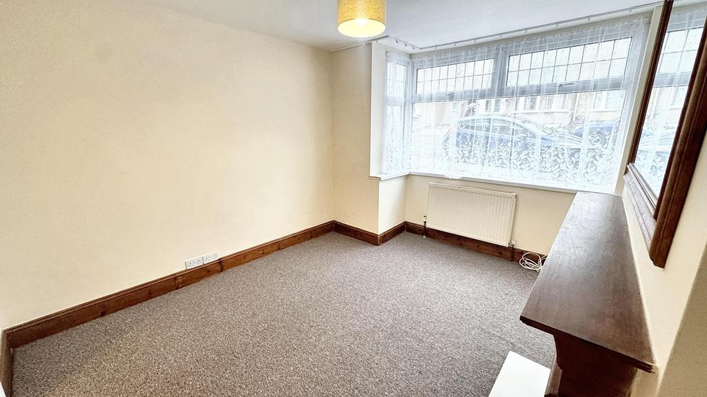 Bright double bedroom with a large bay window p...