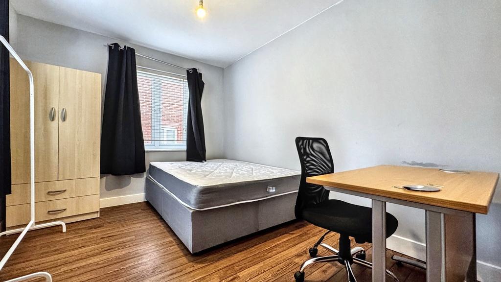 Bright, neatly presented bedroom with a double ...