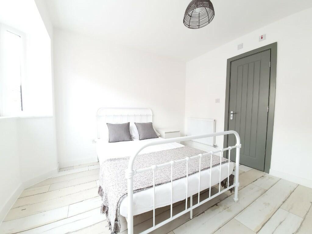Bright and inviting double bedroom featuring a ...