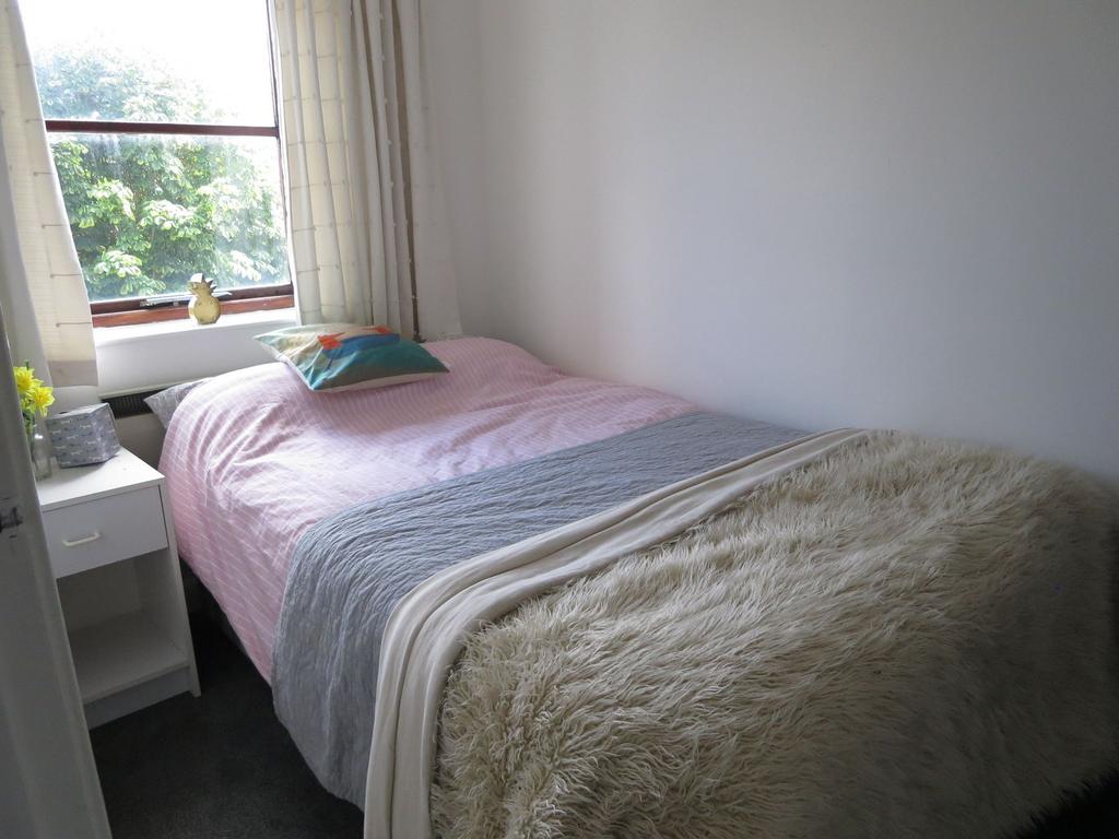 Bright and inviting double bedroom featuring a ...