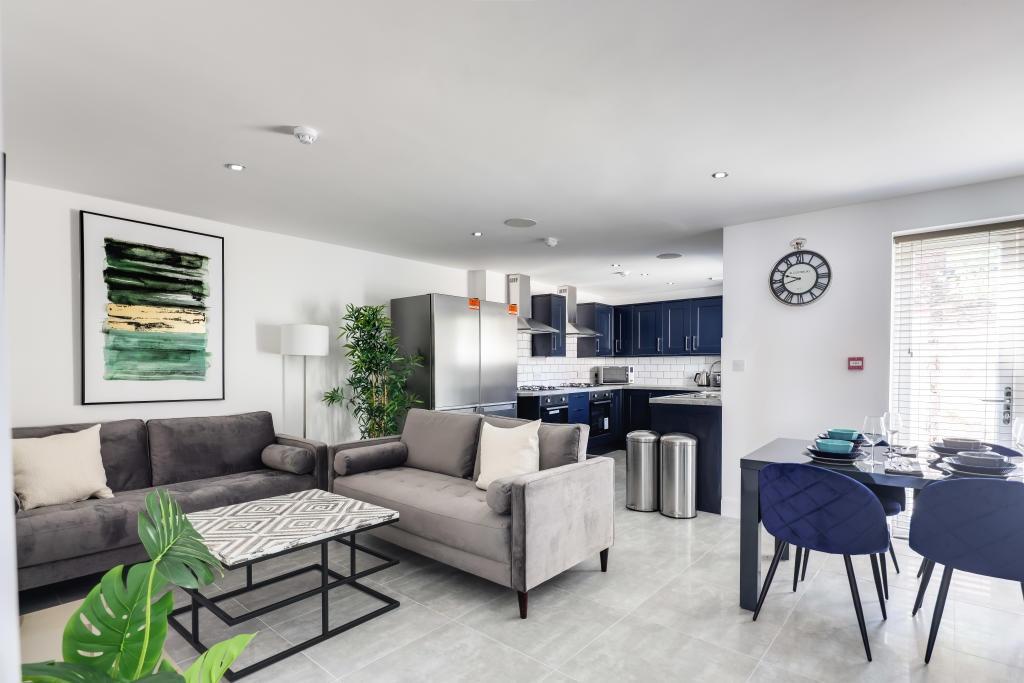 A bright and spacious contemporary living room ...