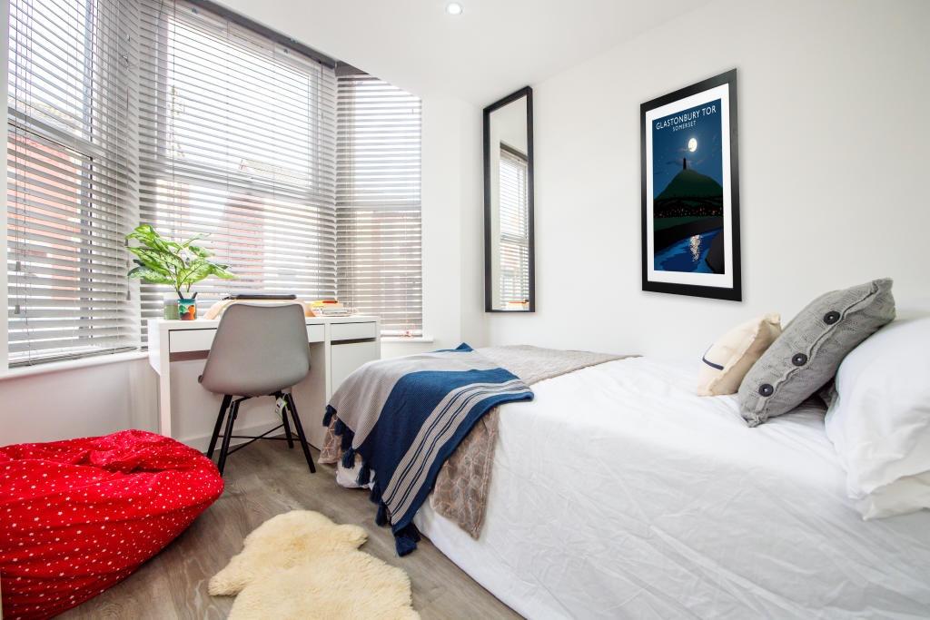 Bright and inviting single bedroom featuring a ...