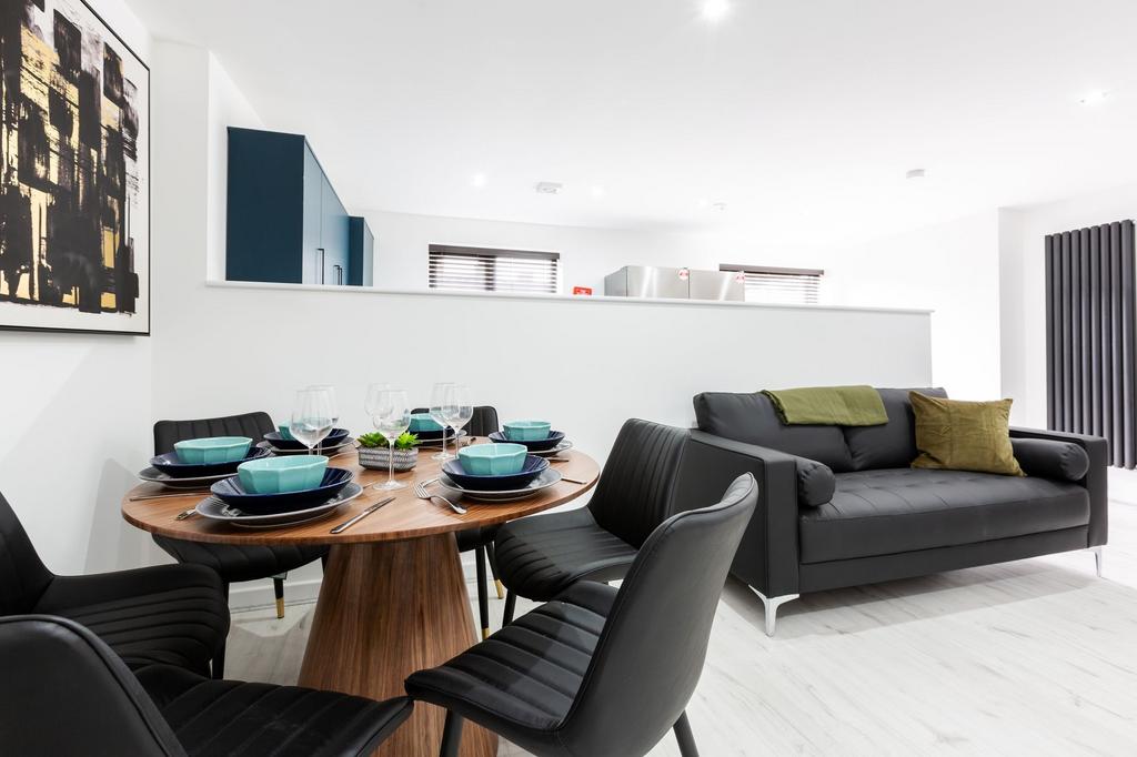 Modern and stylish living room featuring a cozy...
