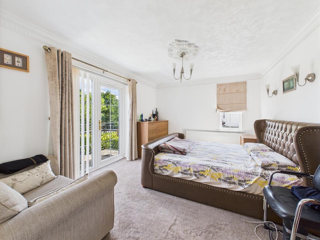 Master bedroom suite with dressing area and...