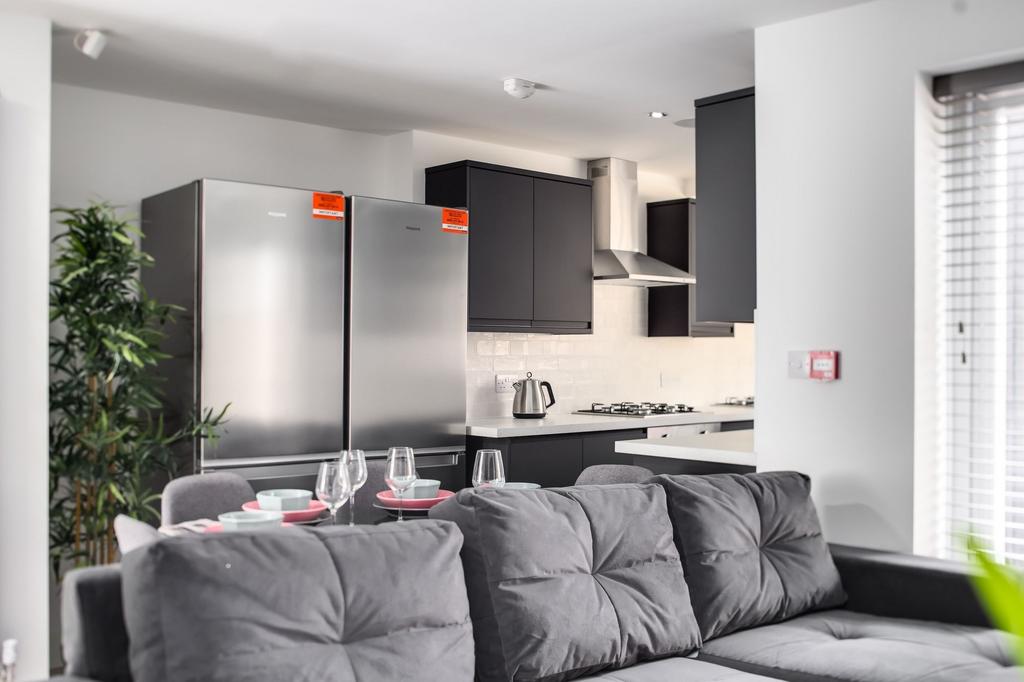 A modern, well-maintained kitchen featuring sta...