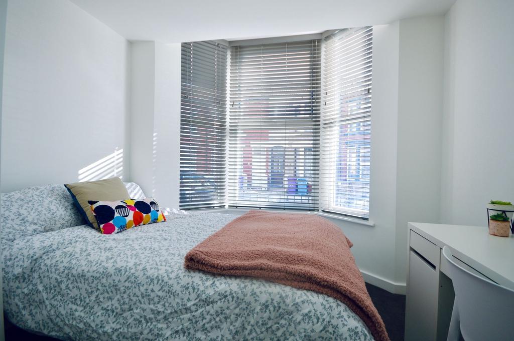 Bright and stylish double bedroom featuring a c...
