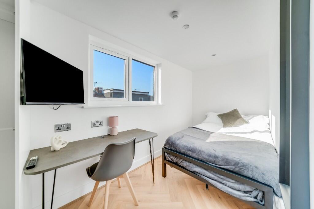 Bright and modern bedroom with a comfortable do...