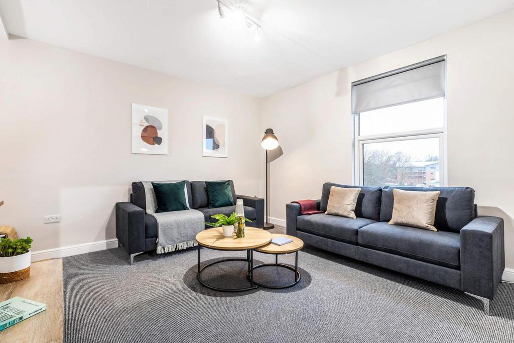 Bright, modern living room with two comfortable...