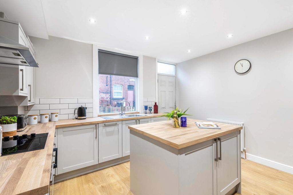 Bright, modern kitchen with a central island, w...