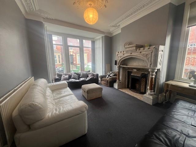 Spacious, well-appointed living room with high ...