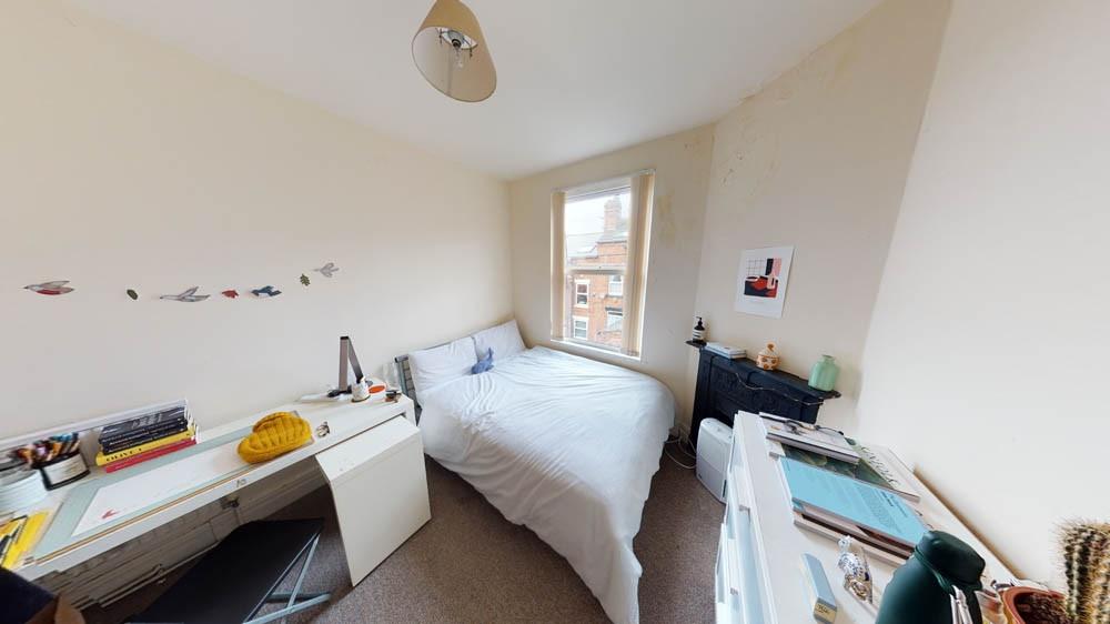 Bright, neatly presented bedroom with a double ...