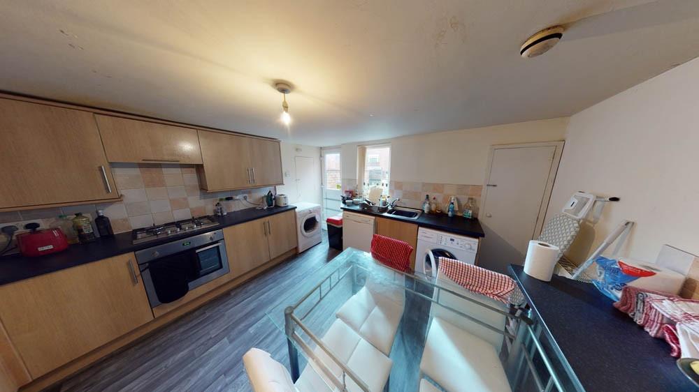 Modern kitchen with a long run of wood-effect c...