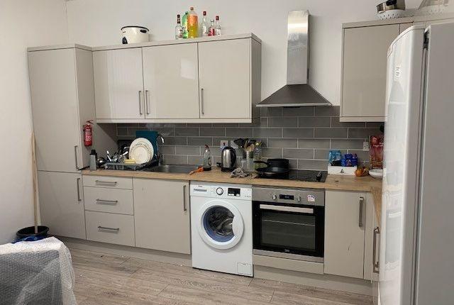 Modern styled kitchen with integrated oven, hob...