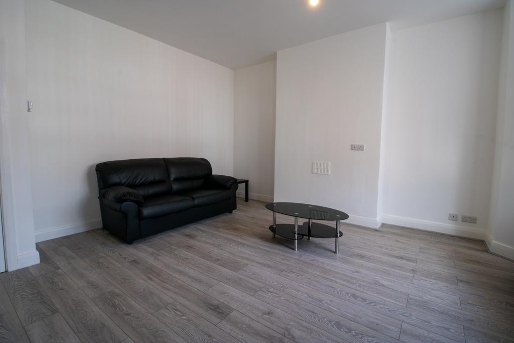 Bright, modern living area with contemporary wo...