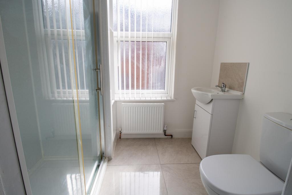 Bright, modern bathroom with a walk-in shower, ...