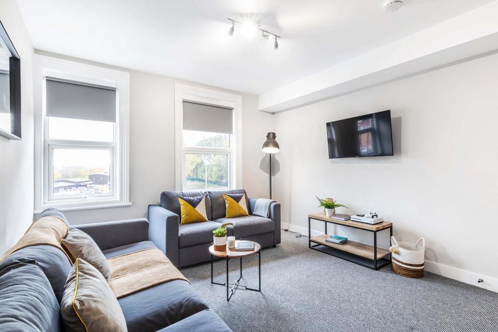 Bright, modern living room with comfortable L-s...