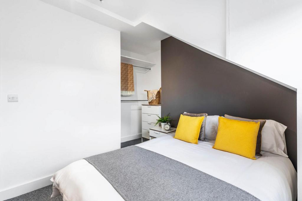 Bright, modern bedroom with a comfortable doubl...