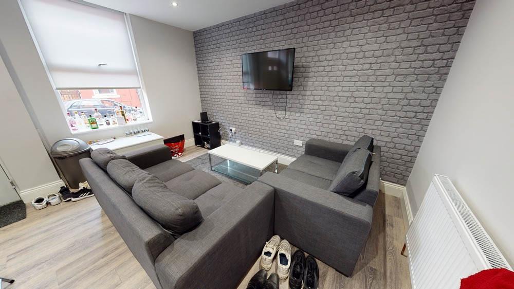 Bright, modern living room with a large L-shape...