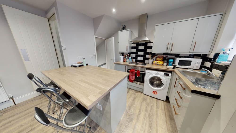 Bright modern kitchen with a central island bre...