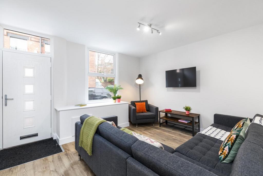 Bright, contemporary living room with a large L...