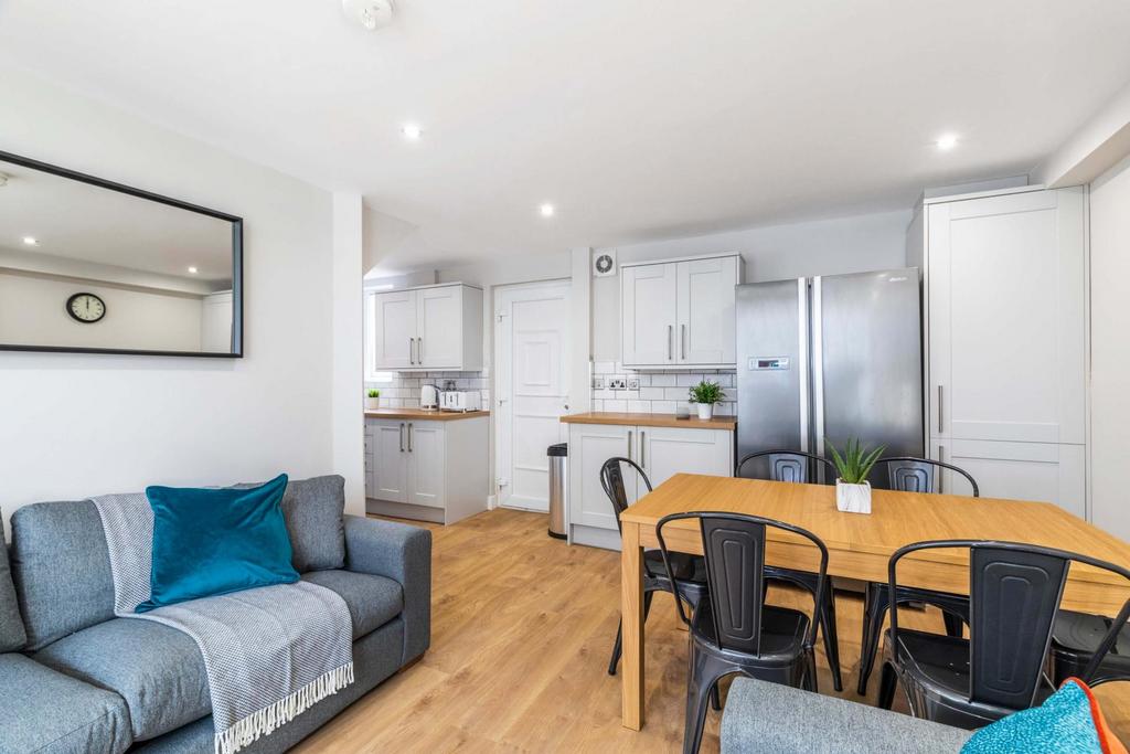 Bright, modern open-plan living area with comfo...