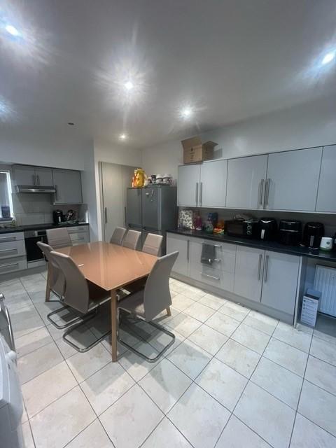 Bright modern kitchen with an integrated cookin...